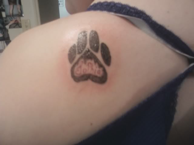 Deceased pet tattoo fail. It resembles an infectious. Dog Paw.